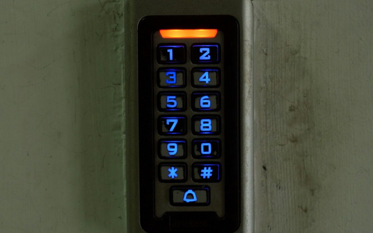 Illuminated access control keypad on a wall