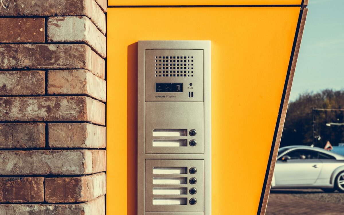Video intercom panel mounted beside a front entrance